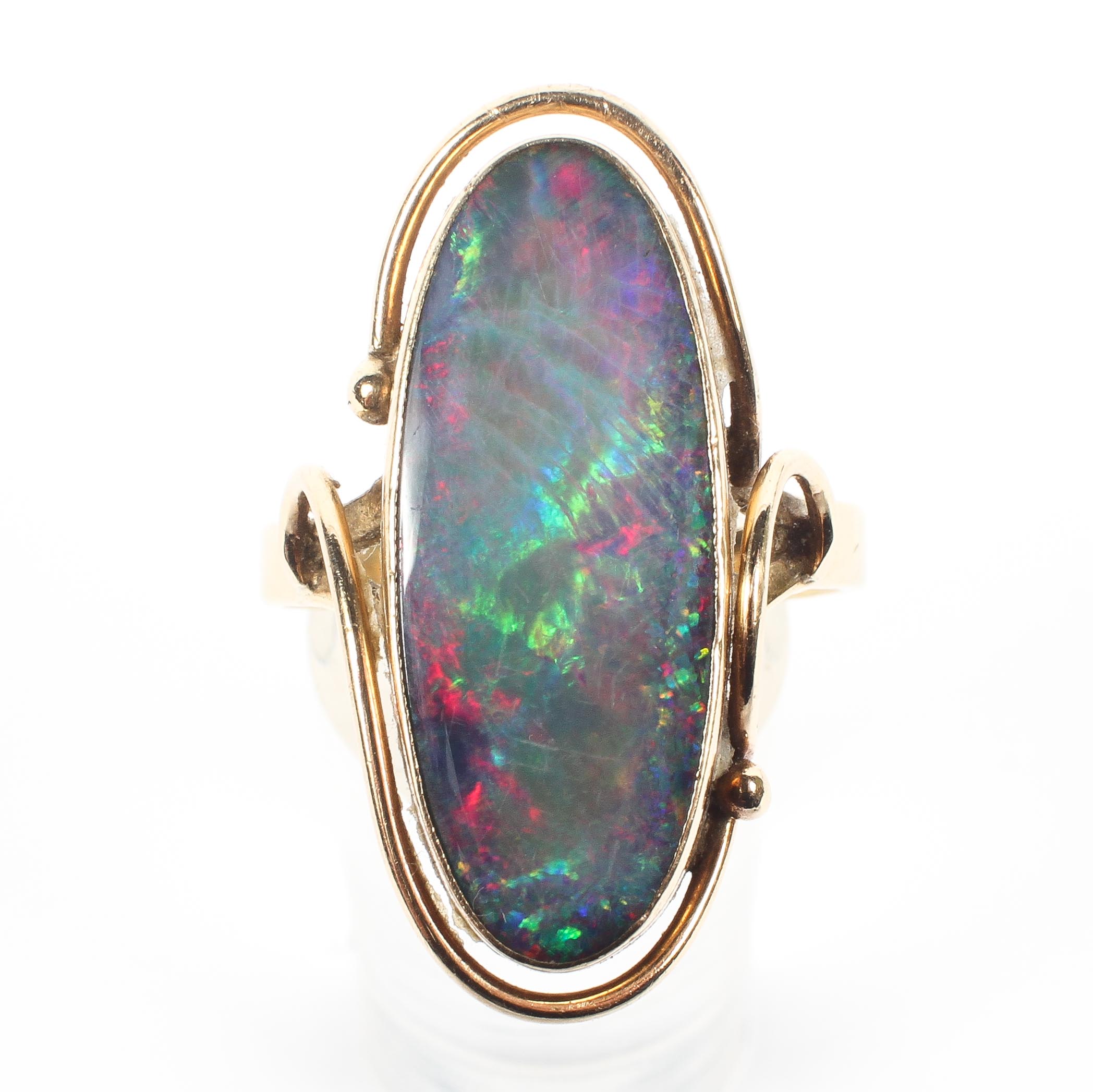 A 15ct gold black opal dress ring, oval black opal triplet in bezel setting. 5.8g Size S. - Image 2 of 4