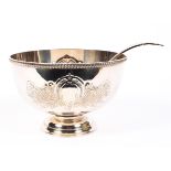 A silver plated punch bowl and ladle,