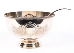 A silver plated punch bowl and ladle,