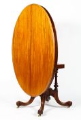A Victorian style mahogany tilt top table, of oval form,