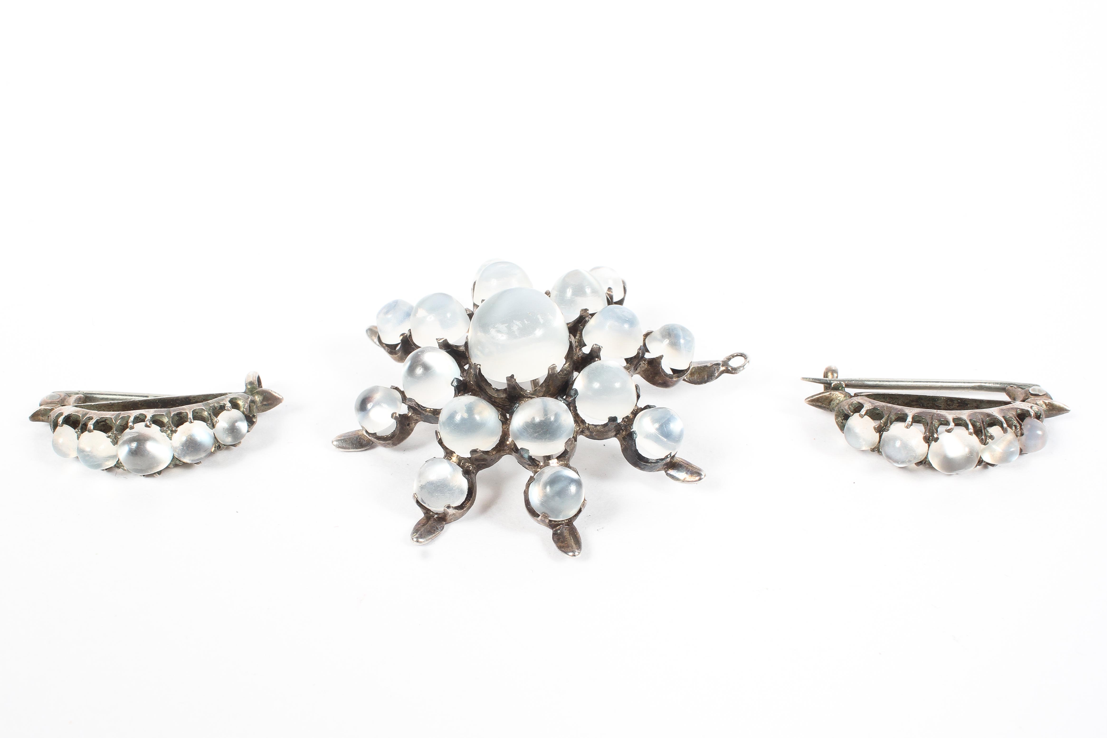 A Victorian moonstone set star brooch together with matching moonstone lapel clips.