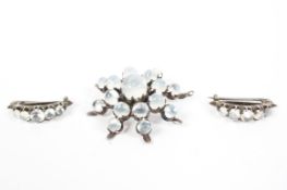 A Victorian moonstone set star brooch together with matching moonstone lapel clips.