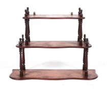A Victorian mahogany hanging three tier shelf, of serpentine outline,