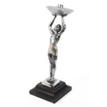 An Art Deco chromed metal figural table lamp, cast as a female nude,