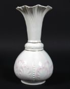 A Belleek parian Rosemore vase, printed brown mark, the vase moulded with scallop shells,