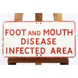 A rectangular enamel sign in red and white reading 'Foot and Mouth Disease Infected Area',