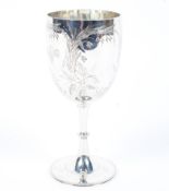 A Victorian sterling silver wine goblet with chased decoration. by Charles Boynton London 1875 146g.