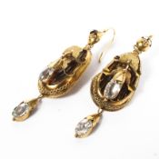 A pair of Etruscan style drop earrings each set with paste stones. 4.3g.
