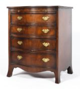 A Victorian mahogany serpentine chest of four graduated drawers