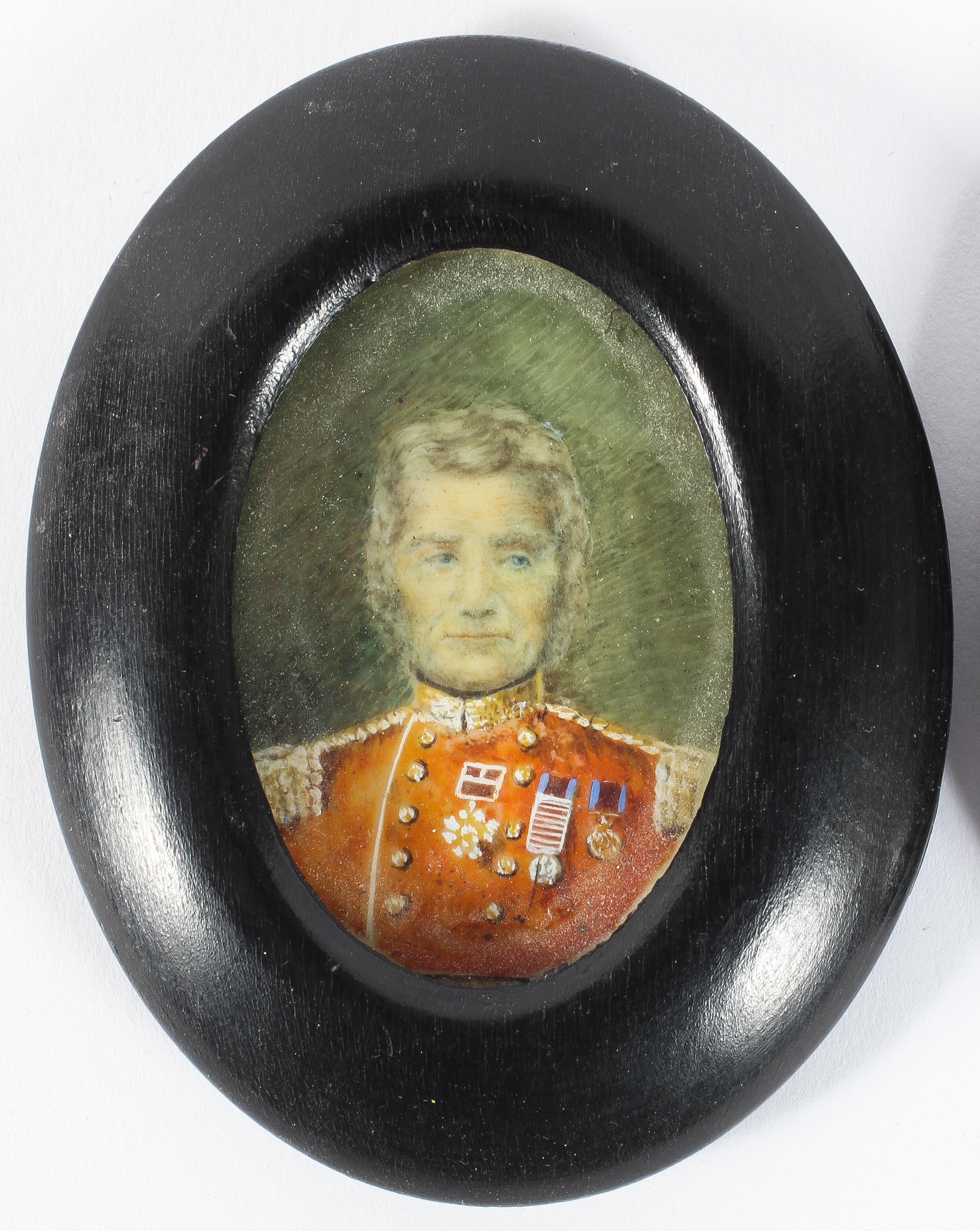 A pair of Victorian portraits of a gentleman and his wife on ivory, he in military uniform, - Image 2 of 3