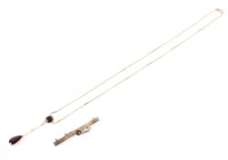 A 9ct gold chain link necklace with a paste set negligee pendant together with a 9ct gold bar