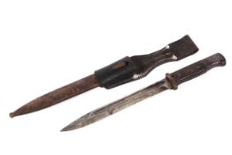 A WWII German bayonet with fullered single blade marked Gebr Heller.