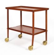 A Danish mid-century teak two-tier trolley, stamped to base with 'John Stuart Inc.