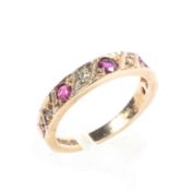 A 9ct gold band half set with alternating single cut rubies and diamonds. Size K. 2.5g.