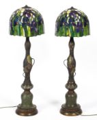 A pair of Chinese cloisonne lamp bases and Tiffany style glass shades,