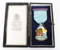 A gilt silver Masonic Jewel medal with enamel decoration, Elopura Lodge.