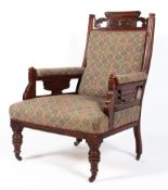 A Victorian mahogany framed armchair, the top rail carved with gadroons and acanthus,