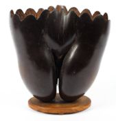 An early coco de mer nut, Lodoicea maldivica carved as a two section basket on oval stand.