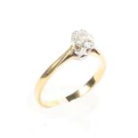 An unmarked yellow metal and single stone diamond ring. Old cut oval approximately 4mm x 3.