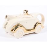 An Art Deco Staffordshire pottery car-shaped teapot and cover, probably Sadler, circa 1930s,