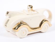 An Art Deco Staffordshire pottery car-shaped teapot and cover, probably Sadler, circa 1930s,
