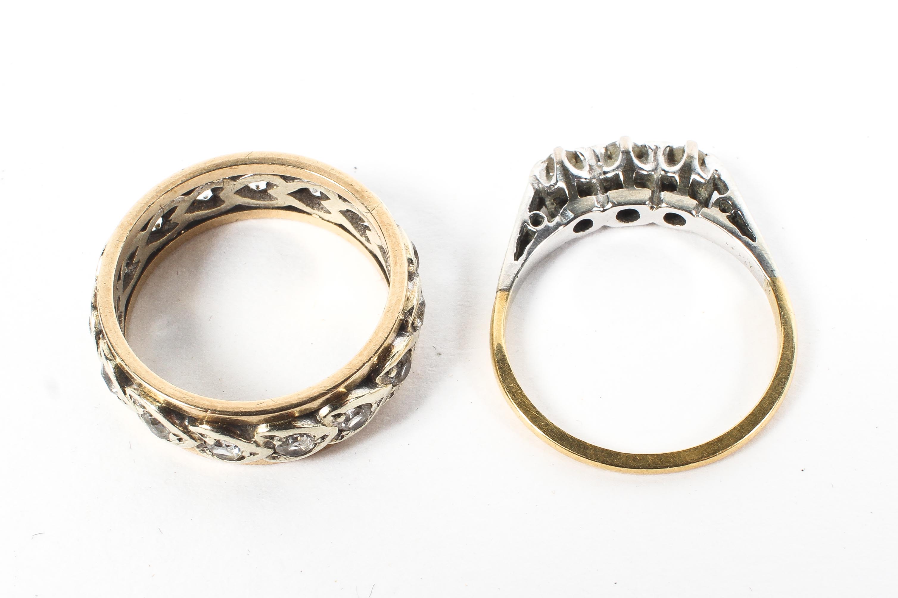 A 9ct gold three stone diamond ring together with a 9ct full eternity ring. 5.6g. - Image 2 of 3