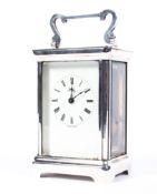 A Henley Carriage Clock Co. silver cased carriage clock