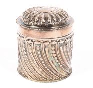 A sterling silver cylindrical tea caddy, retailed by Wilson & Gill London 1873.by William Comyns.