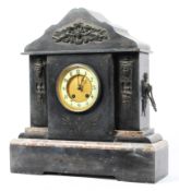 A large French mantle clock, mounted in slate with a pediment top, on a marble plinth,