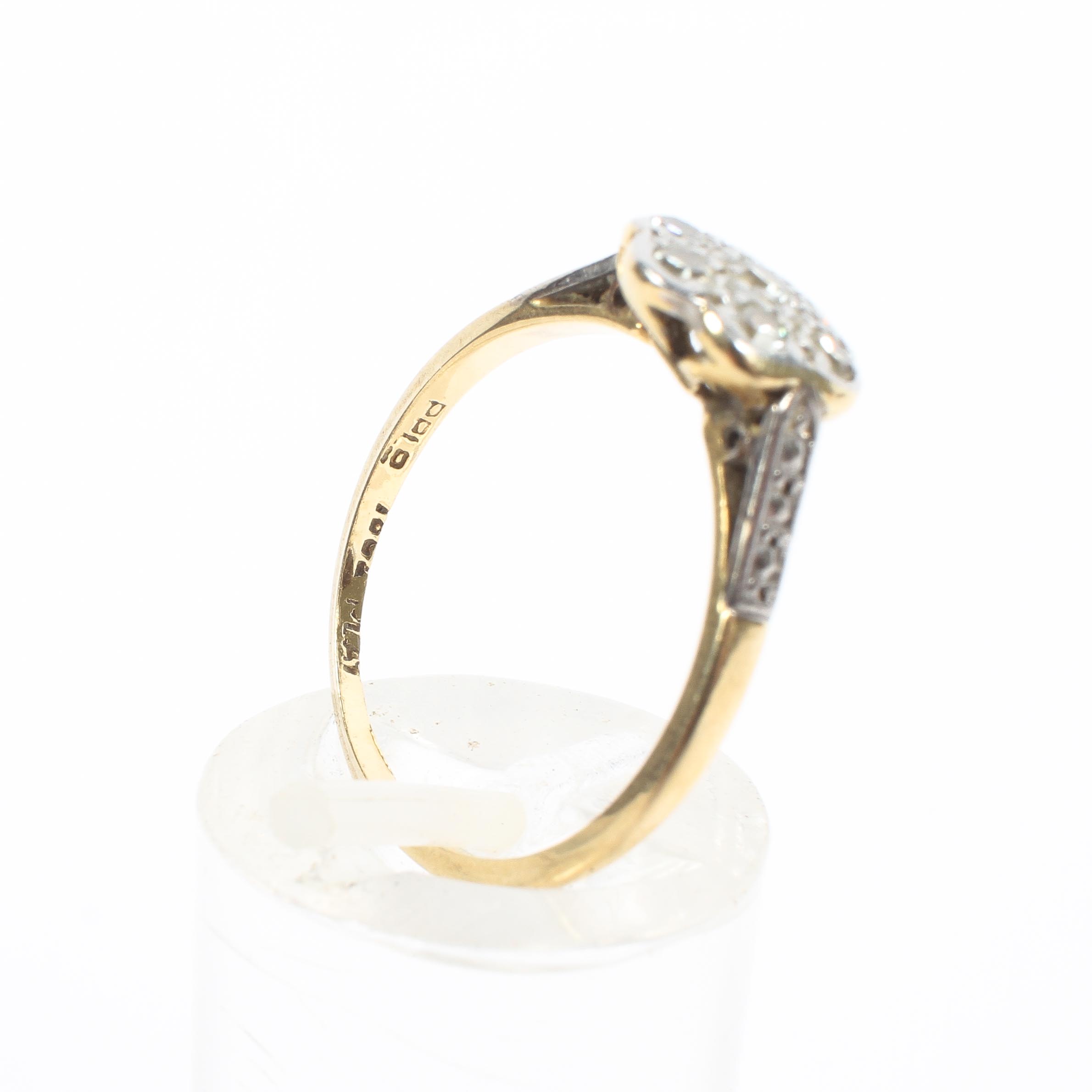 An 18ct gold and platinum flower ring. Set with seven single cut diamonds. 2.1g. Size M. - Image 4 of 4