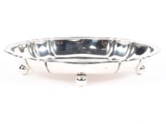 A Continental white metal oval bowl, with scalloped edge on four ball feet stamped 800. approx 320g.