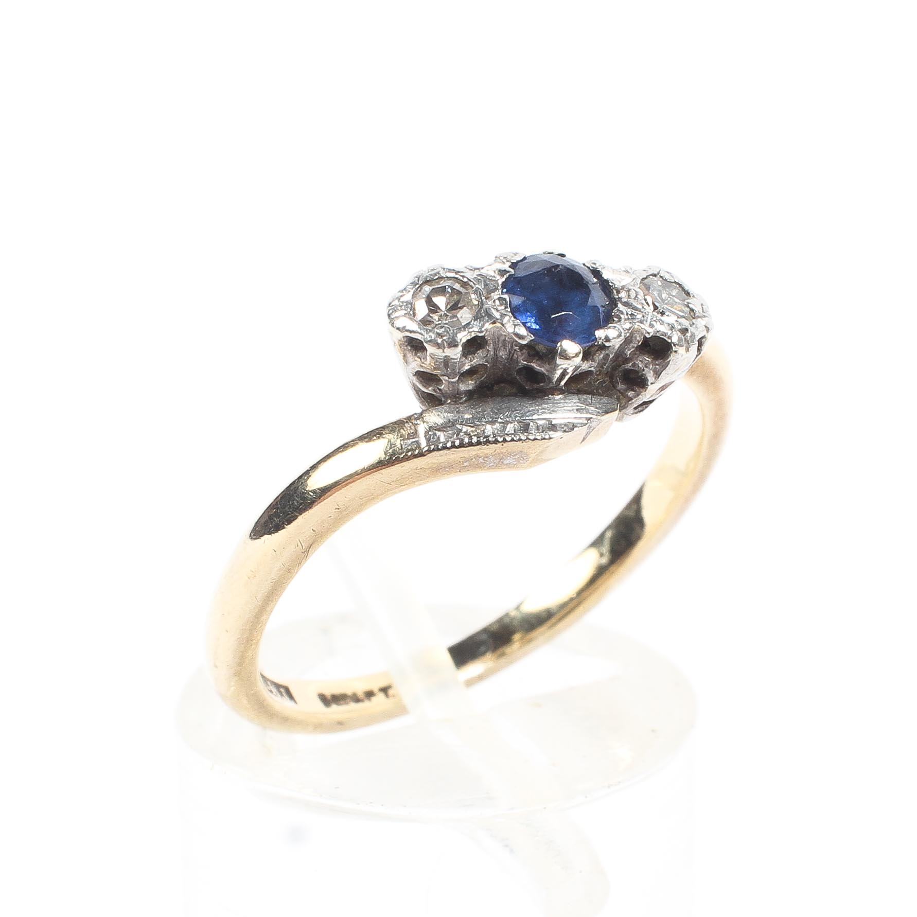 A 9ct gold and platinum sapphire and diamond ring. 2.5g. size M.