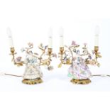 A pair of gilt metal and Continental porcelain twin-light candelabra,