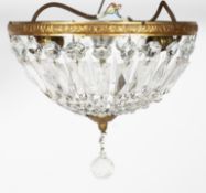 An early 20th century gilt-metal cut-glass bag chandelier,