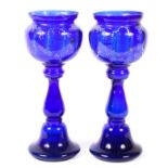 A pair of late 19th/early 20th century blue glass baluster goblets,