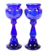 A pair of late 19th/early 20th century blue glass baluster goblets,