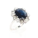 An 18ct white gold sapphire and diamond ring,