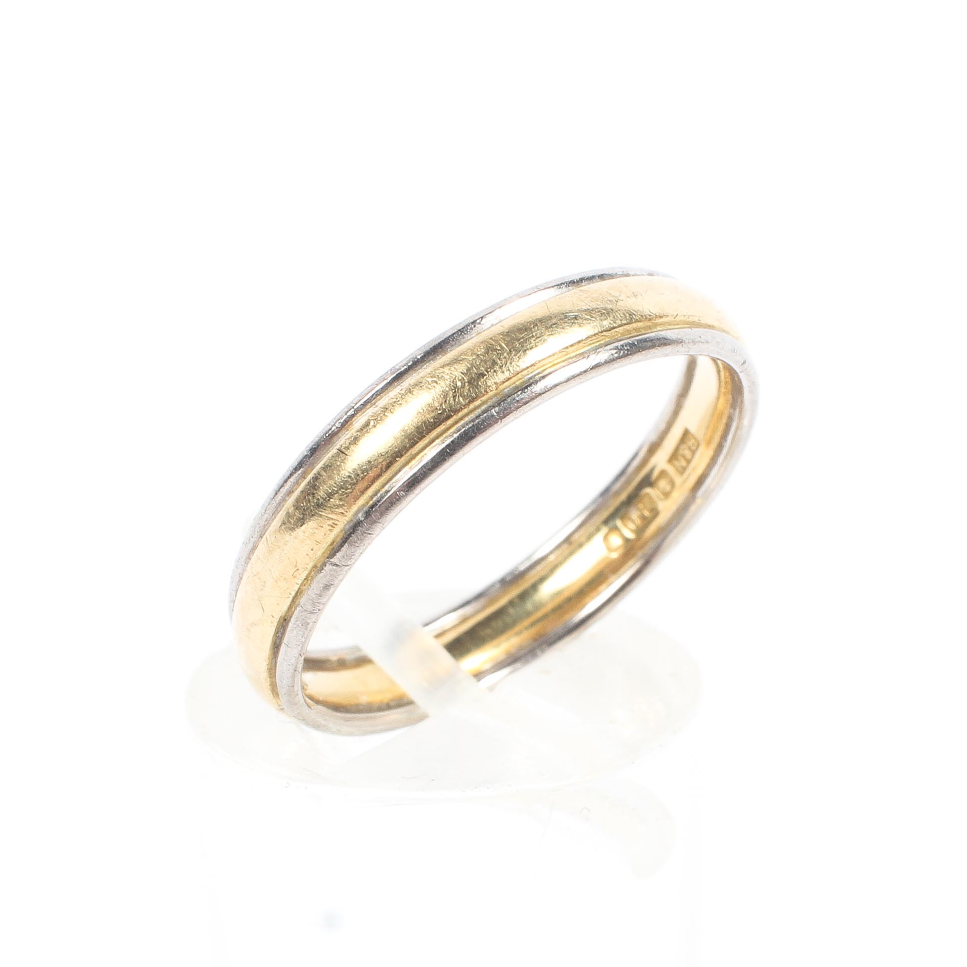 An 18ct gold wedding band. 3.5g. Size N.