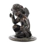 A small bronze model of a seated fairy on a circular base (missing plinth),