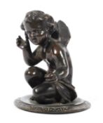 A small bronze model of a seated fairy on a circular base (missing plinth),