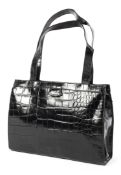 A Mulberry black leather handbag, with tartan lined interior and zip pocket,