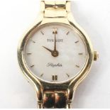 A 9ct gold ladies Tissot cocktail wrist watch, the mother of pearl dial with batons denoting hours,