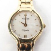 A 9ct gold ladies Tissot cocktail wrist watch, the mother of pearl dial with batons denoting hours,