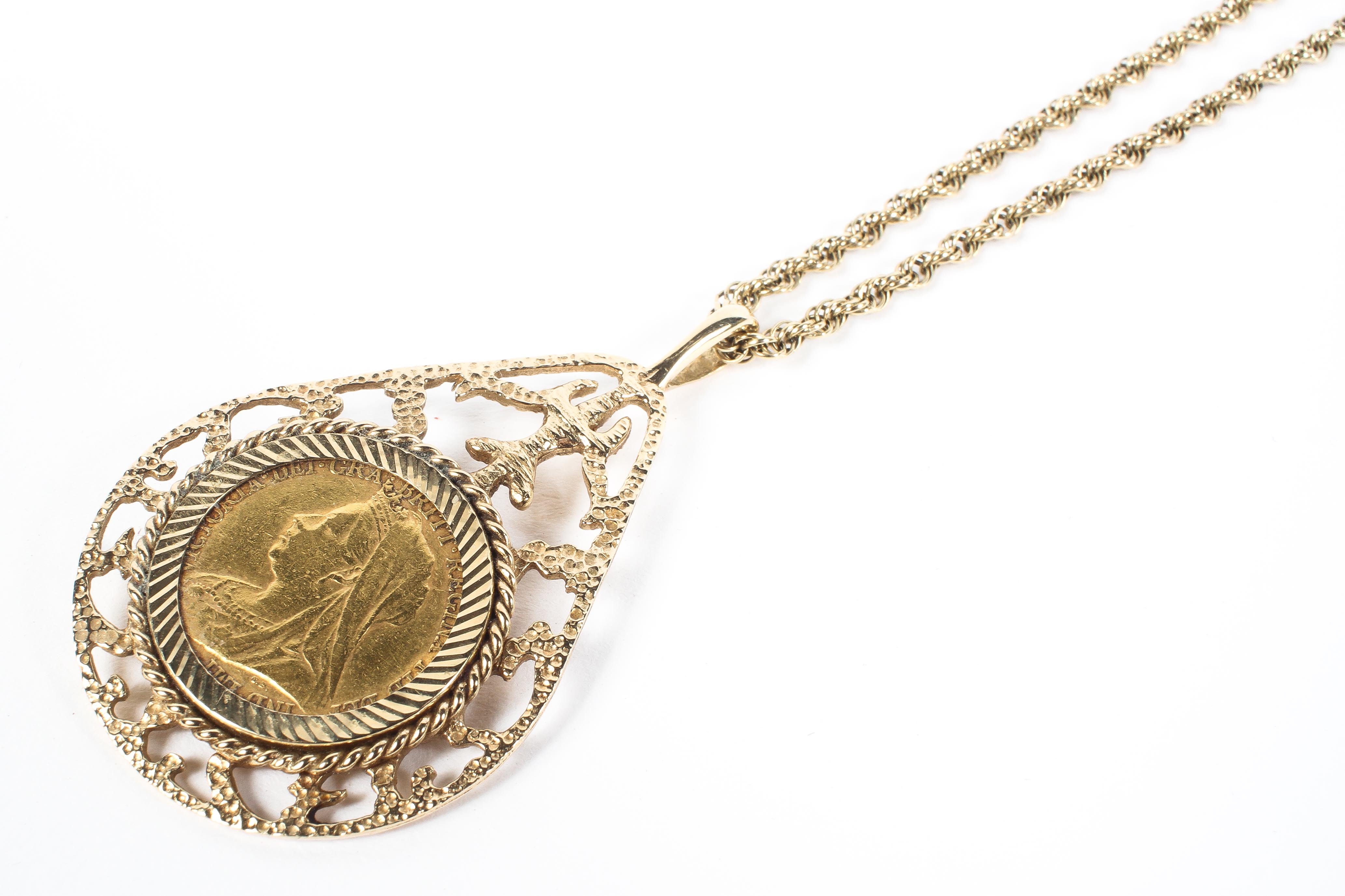 A Victorian half sovereign in 9ct pierced pendant mount on a 9ct chain. 15g. - Image 2 of 2