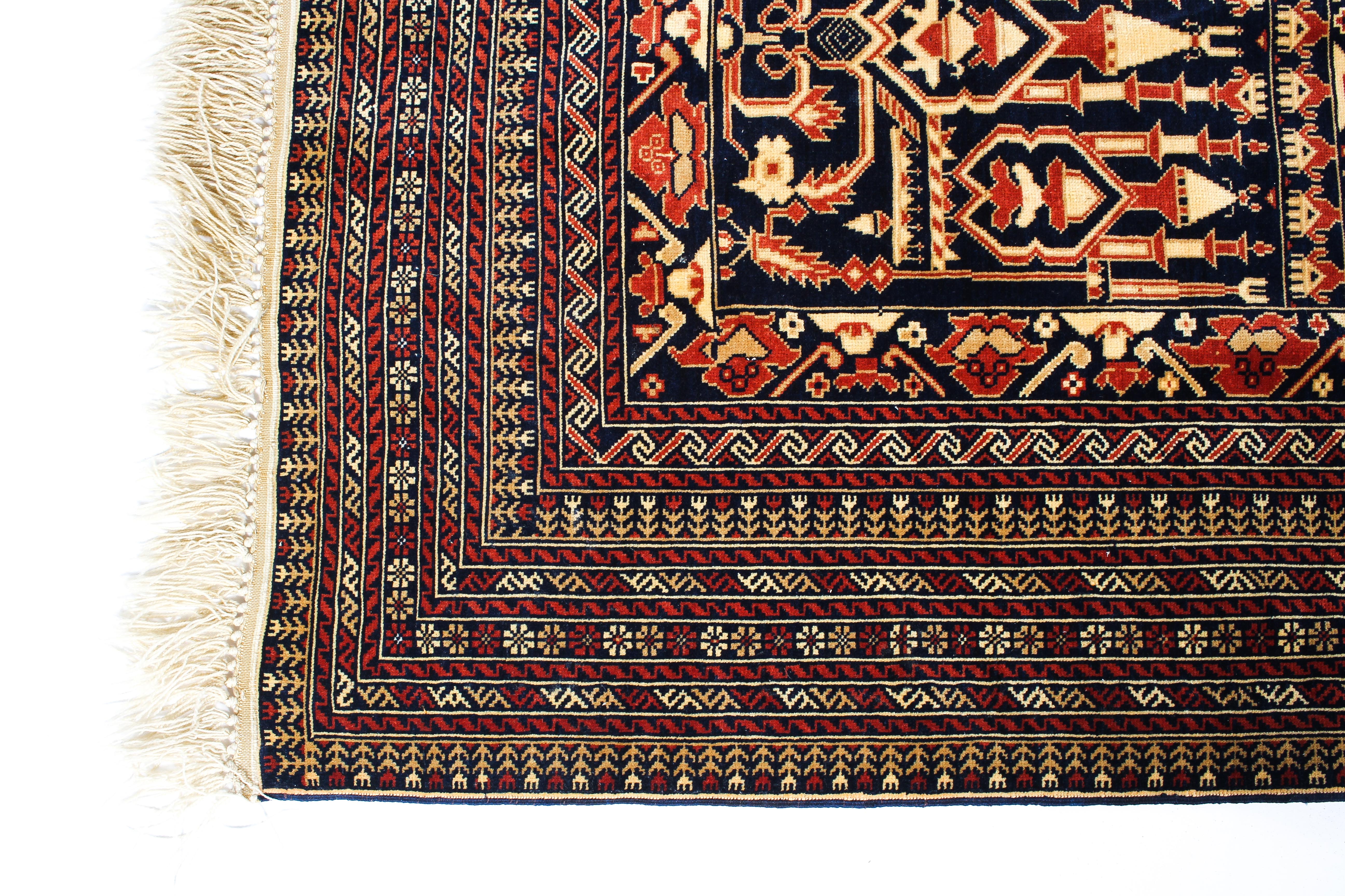 A Persian style wool rug red and cream ground with central geometric panel and geometric borders, - Image 2 of 3