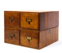 A Crusader oak four drawer cabinet, early 20th century, with brass handles,