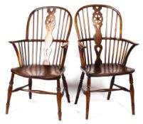 A pair of 19th Century oak wheelback Windsor elbow chairs,