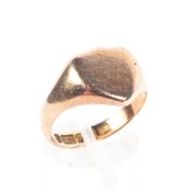 A 9ct rose gold signet ring with shield shaped cartouche. 5.1g. Size N.
