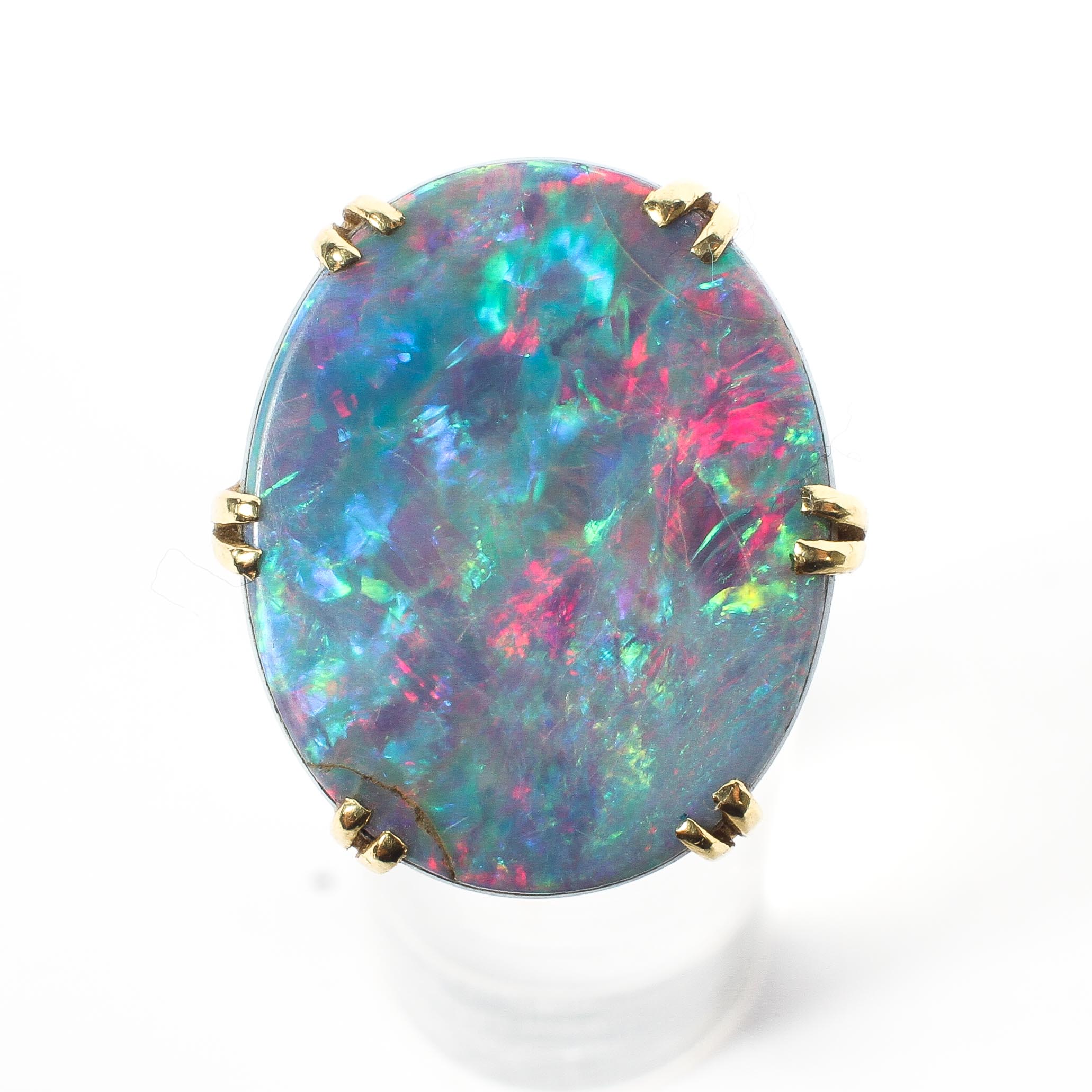 An 18ct gold 750 marked opal doublet ring. Central oval black opal panel in double six claw setting. - Image 2 of 4