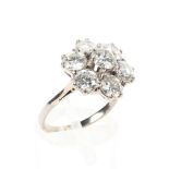 An unmarked platinum and diamond flower ring.